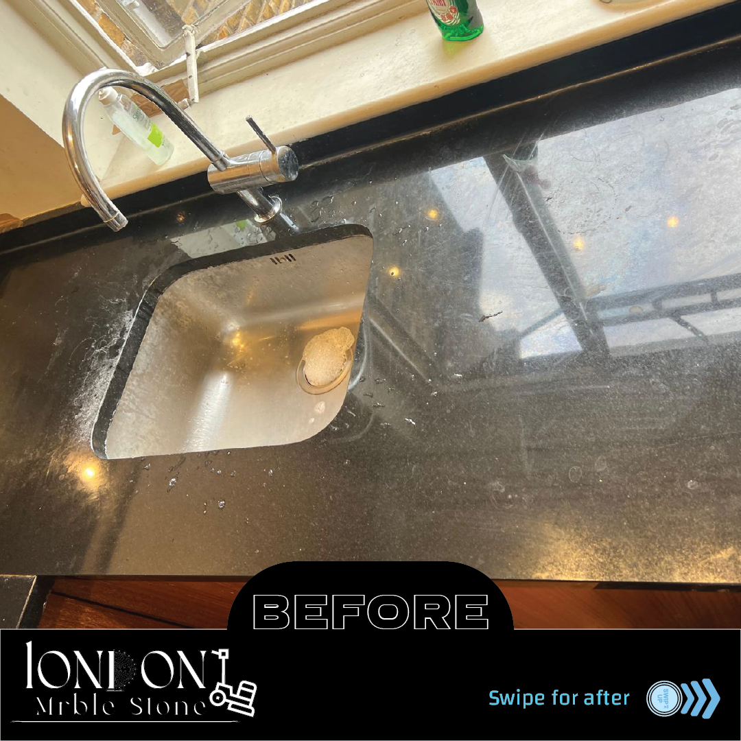 Black granite kitchen worktop before polishing with dull and scratched surface